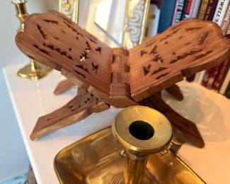 Carved wooden butterfly sculpture on brass candlestick holder