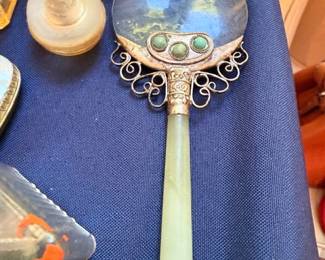 Vintage ornate hand mirror with gemstone cabochon decorations