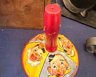 Vintage tin litho spinning top with clown circus design, antique toy collectible