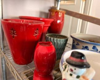 Red pottery vases with pine tree designs, vintage ceramic planters, colorful glazed pots collection
