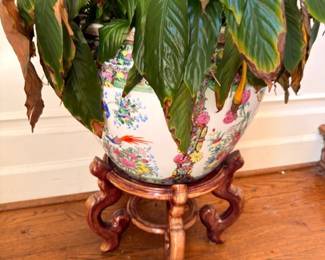 Chinese porcelain fishbowl planter with hand-painted design on carved wood stand