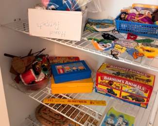 Assorted vintage toys on shelf, Barnum's Animals tin, figurines, children's toys and collectibles lot