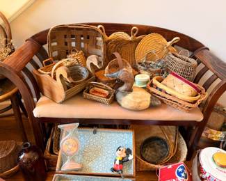 Packed wooden bench with baskets, Mickey Mouse figurine, mugs, vintage collectibles