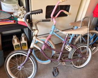 Vintage kids bicycles, pink and purple banana seat bikes, retro children's bikes pair