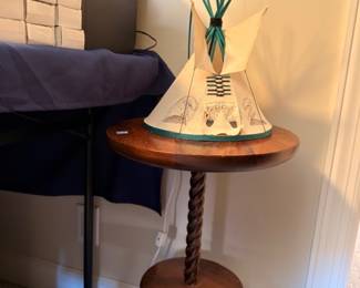 Decorative sailboat model on barley twist accent table, nautical decor
