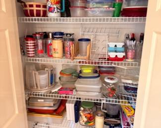 Pantry full of plastic storage containers Tupperware, food storage lids, kitchen organization lot