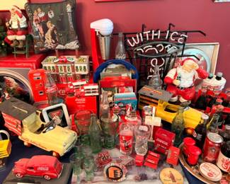 Coca-Cola collectibles, vintage Coke Santa figurine, toy trucks, bottles, advertising signs