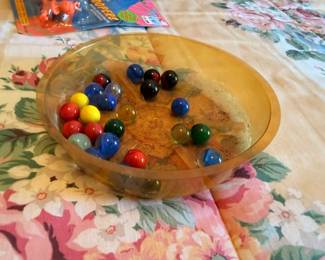 Vintage glass marbles collection in amber bowl, colorful collectible marbles lot