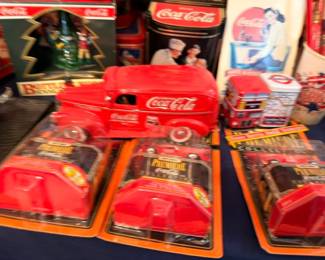 Coca-Cola die-cast toy trucks in original packaging, boxed Coke vehicle collectibles