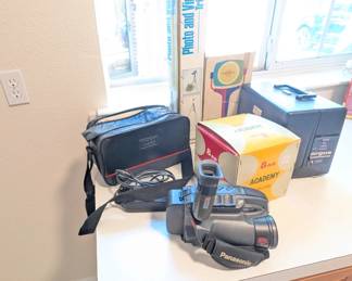 8mm video camera and film, light bar, editor, and projector.