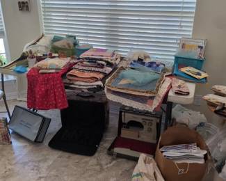 Manny quilts and unfinished projects, lots of scraps and batting.