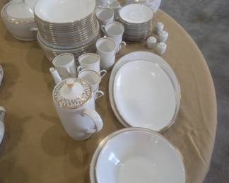 Beautiful white and gold German porcelain set for 12 and all the serving dishes.