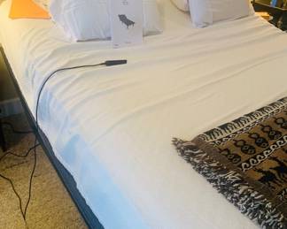 King bed with base that moves up and down. 