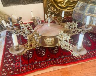 French Rococo five light chandelier featuring cherubs