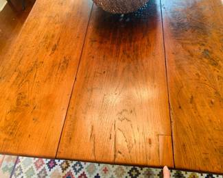 Notice the wide old growth boards and the small repair made at least a hundred years ago. My finger is pointing.