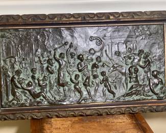 A Bronze framed plaque of a Bacchanalian scene that features drunkenness, Putti’ (cherubs) and Saturday (1/2 man and 1/2 goat). In the style of French sculptor Claude Michel (Clodion 1738-1814)