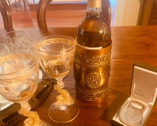 vintage Murano glass Dolphin stemware, an early French copper and brass wine bottle holder, and a Christofle bottle opener