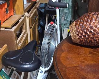 item is a Schwinn Airdyne exercise bike, featuring a signature front fan wheel for air resistance.