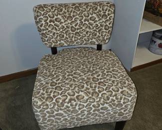 This item appears to be the Entelman Slipper Chair from Rooms To Go, featuring a leopard print upholstery.