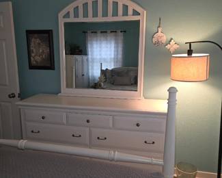 white bedroom dresser and mirror set, similar in style to the Robbinsdale collection which includes seven drawers and a top arched mirror.