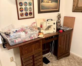 Electric adjustable height sewing cabinet