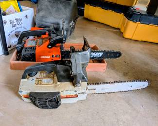 Multiple gas powered chain saws - in the process of testing