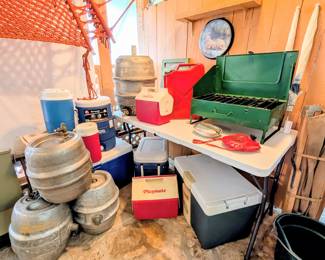 Beer kegs converted to water containers for camping. Various coolers