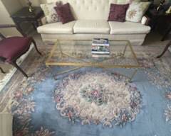 SOFA, GLASS TOP COFFEE TABLE, AREA RUG, LAMPS, DECOR