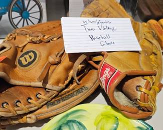 TWO BASEBALL GLOVES