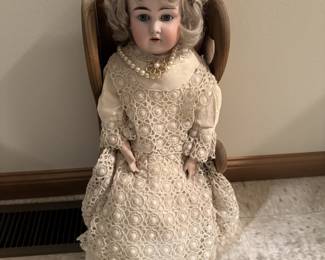 Ceramic large doll about 20 inches tall with wooden chair and pearls! 