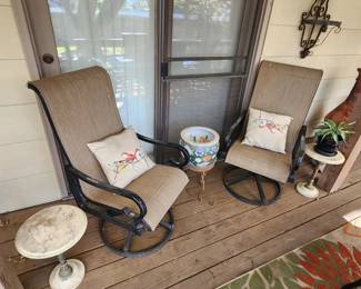 Two Patio Swivel Rockers and plant stands/planters