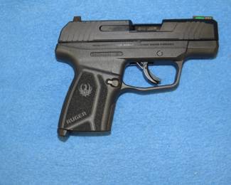 Lot 12. Ruger Max-9 9mm semi-auto pistol. S/N 350044534. Never been shot. Includes two magazines, manual, gun lock, and original box.