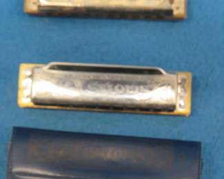 Lot 134. Two vintage harmonicas: Wm. Kraft Co. 10-hole diatonic harmonica. Sounds great. Unknown maker St. Louis 10-hole diatonic harmonica with a vinyl case. Made in Korea.