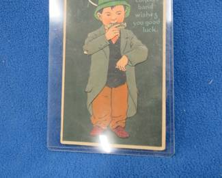 Lot 79. Antique harmonica-themed postcard mailed in the early 1900s
