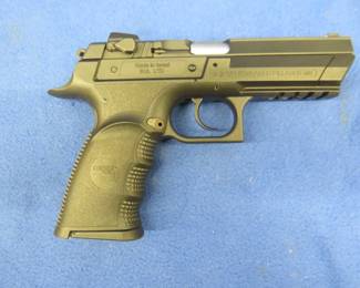 Lot 302. Magnum Research 9mm Baby Desert Eagle. S/N PB104251. Never been fired. Includes two magazines, manual, gun lock, and case.