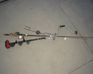 Lot 245. Vintage fishing rods and reels, ice auger, and a garden decoration