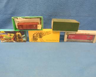 Lot 113. Five model train cars in their original boxes. Georgia Pacific is for parts or repair.
