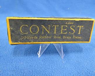 Lot 37. Schunk Contest 10-hole diatonic A440 harmonica in the key of C. Sounds great. Box has two ripped corners, but is otherwise in VGC.