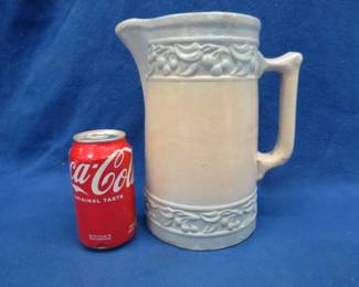 Lot 313. Red Wing cherry band pitcher. Small chips in rim.