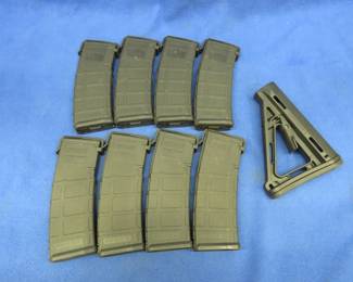 Lot 96. Eight PMAG Gen M2, 5.56 / .223 30-round magazines with covers and a MAGPUL buttstock