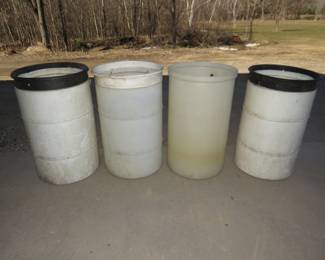 Lot 247. Four hard plastic barrels or long-handled tool bins