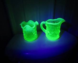 Lot 306. Uranium glass cherry pattern spooner and creamer. Vaseline color with opalescence.