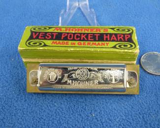 Lot 173. Vintage M. Hohner's Vest Pocket Harp 10-hole diatonic harmonica in the key of C in the box. Sounds great and both in excellent condition