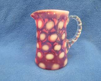 Lot 312. Small Fenton Cranberry coin dot glass pitcher in very good condition