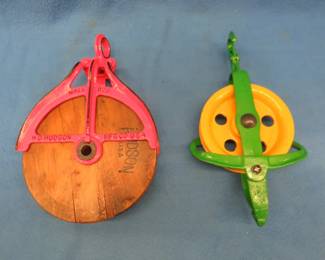 Lot 124. Two vintage pulleys: 9" dia. wooden pully marked Mall 829 H.D. Hudson Mfg. Co. USA. 6 1/2" dia. steel pulley marked Pat Jan 10 05.