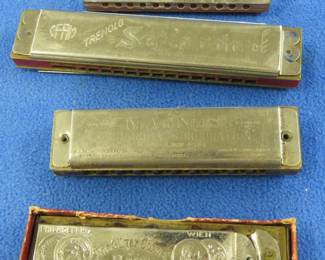 Lot 177. Four vintage harmonicas: CFAM Tremolo Serenada 32-hole tremolo harmonica in the key of C made in Poland. Magnus International Harmonica Co. Super Scout 10-hole diatonic harmonica. Sounds great.. Frost? Bros. The Silver Cornet Harp in poor condition. Our Newsboys harmonica in poor condition