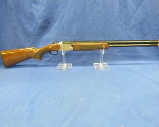 Lot 301. Charles Daly Model 202 over/under 20-gauge. S/N 200U20C-1854. Never been fired. Includes choke set, manual, gun lock, and original box.