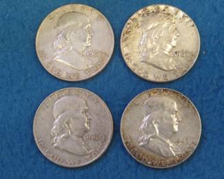 Lot 207. Four Franklin Half Dollars