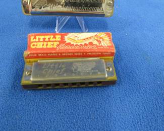 Lot 133. Two vintage harmonicas: Wm. Kraft Little Chief diatonic harmonica. Sounds great. The box is missing the ends.  German 10-hole diatonic harmonica in the key of G. Sounds great.