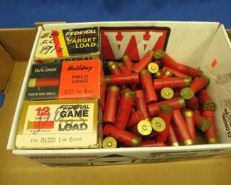 Lot 210. 125+ Shotgun shells that may be reloads. Use at your own risk. AS-IS. Most are 7 1/2, 8, or 9-shot in AA hulls. Also included is a vintage Holiday shotgun shell box.